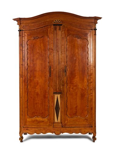 A Continental Parquety Inlaid and Carved Fruitwood Armoire
Height 110 x width 55 1/2 x depth 16 inches.