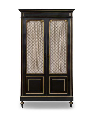 A Regency Style Ebonized and Gilt Metal Mounted Cabinet
Height 86 1/4 x width 49 x depth 17 1/2 inches.
