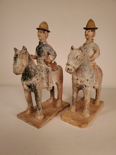 A pair of Chinese Yuan/Ming green-glazed equestrians