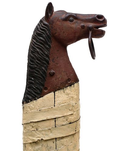 A RARE 19TH CENTURY CAST IRON HORSE HEAD HITCHING POST