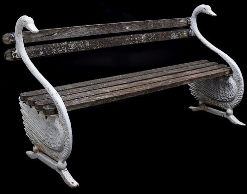 A VICTORIAN BENCH WITH LARGE CAST IRON SWAN SUPPORTS
