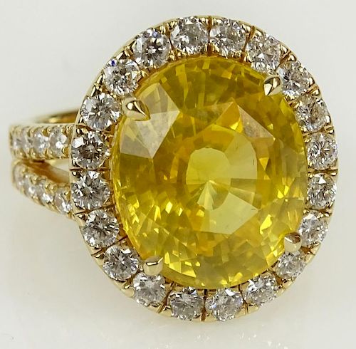 GIA certified 12.65 carat oval cut natural sapphire, 1.15 carat round cut diamond and 18 karat Gold ring.