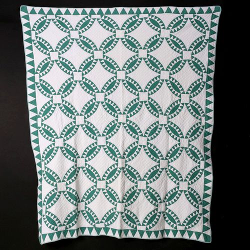 AN EARLY 20TH CENTURY INDIAN WEDDING RING PATTERN QUILT