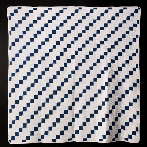 AN EARLY 20TH C. BLUE AND WHITE FOUR-PATCH QUILT