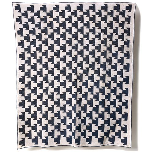 AN EARLY 20 C. BLUE AND WHITE T-QUARTETTE PATTERN QUILT