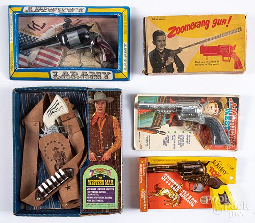 Five toy guns with boxes