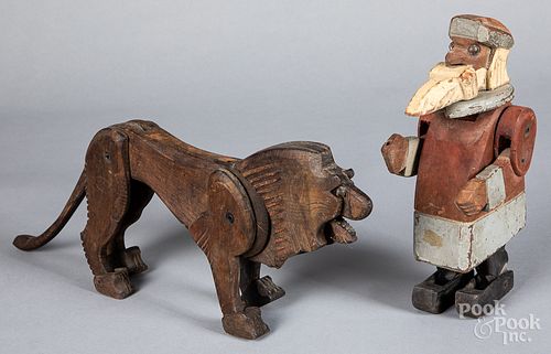 Carved wood painted Santa Claus and a wood lion