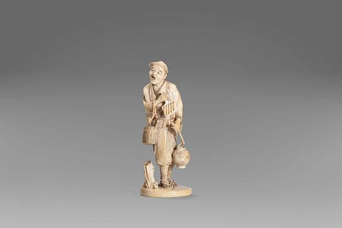 Ivory sculpture depicting a male figure with ivory lantern, Japan Meiji period