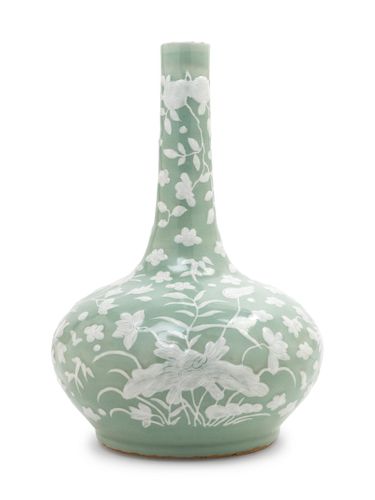 A Celadon Ground White Slip-Decorated Porcelain Bottle Vase
Height 13 in., 33 cm.