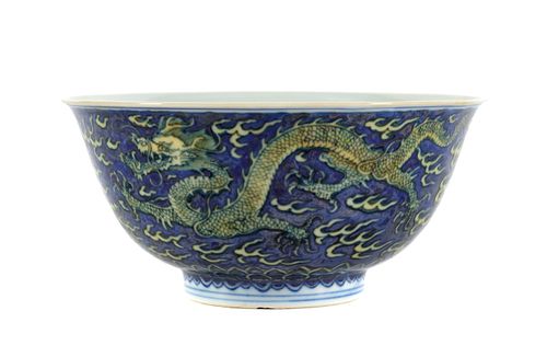A Blue and White and Yellow Enameled Porcelain 'Dragon' Bowl
Height 2 5/8 x diameter 5 7/8 in., 6.5 x 14.9 cm.