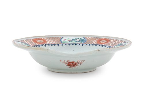 A Chinese Export Famille Rose Porcelain Barber's Basin
Length 12 in., 30.5 cm.