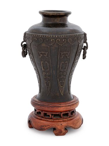 A Bronze Handled Vase
Height of vase 6 1/4 in., 2.46 cm.