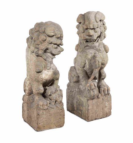A Pair of Large Carved Stone Figures of Fu Lions