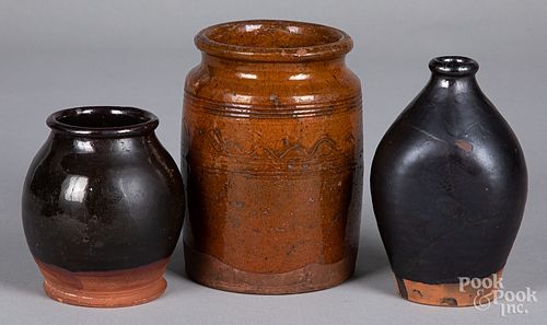 Two redware crocks and a bottle, 19th c.