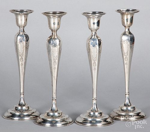 Set of four sterling silver weighted candlesticks