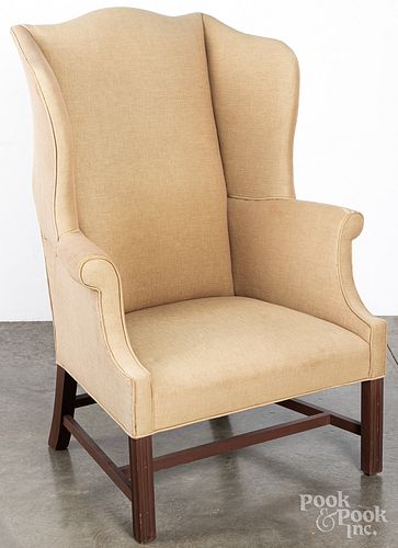 Two Chippendale style wing chairs.