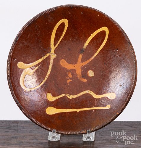 New England slip decorated redware plate, 19th c.