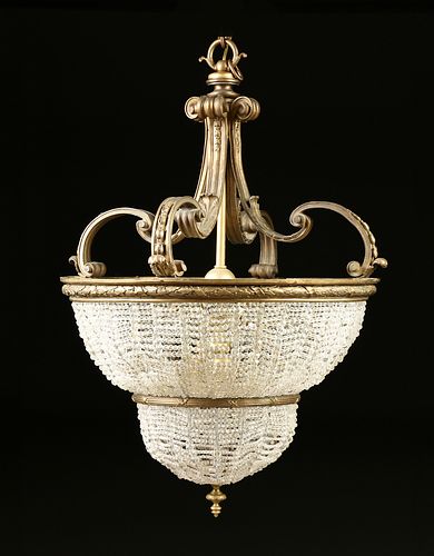 A BEAUX ARTS GILT BRONZE AND CLEAR GLASS BEAD NINE LIGHT CHANDELIER, LATE 19TH/EARLY 20TH CENTURY, 