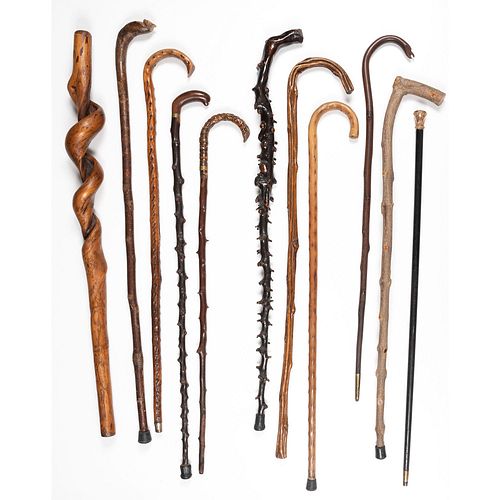 A Group of Carved Wooden Canes and Walking Sticks