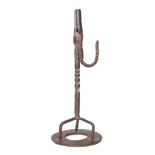 A Wrought Iron Rush Light sold at auction on 23rd September | Bidsquare