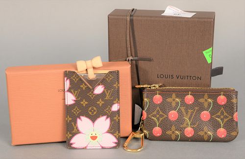 Two Louis Vuitton pieces to include change purse, pochette monogram with cherries, includes original receipt, box, tags and dust bag along with etui m