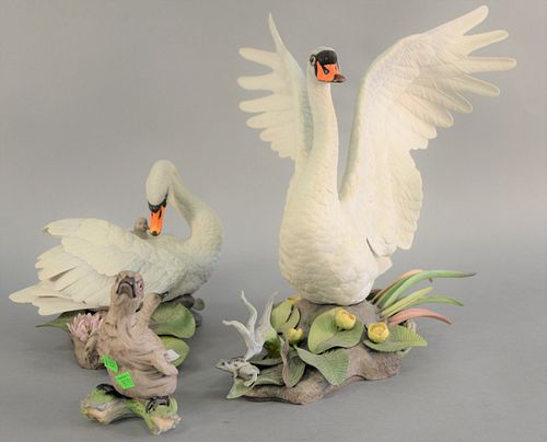 Three Boehm "Muted Swans" porcelain sculpture group to include female with cygest 400 - 1A, male with wings spread 400 - 1A, and single cynet 400 - 27