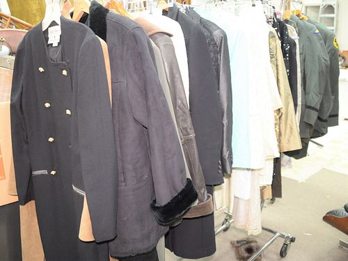 Rack of clothing to include dresses, coats, leather jacket, etc.