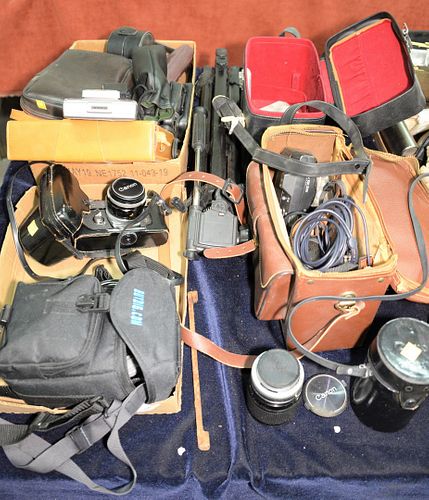 Group of cameras and camera equipment, lenses, Canon FT, etc.