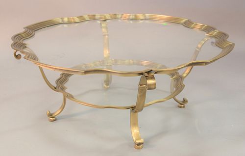 Glass top shaped coffee table with brass trim, two tier, ht. 17", dia. 43".