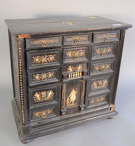 Ebonized desk cabinet with thirteen drawers, bone inlay and ball feet (one foot missing), ht. 21", wd. 21".