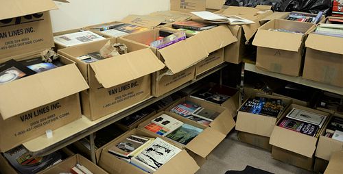 Sixty five boxes of books to include sports, cars, and coffee table books, etc.