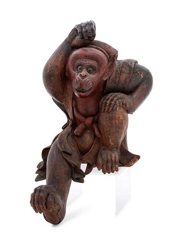 A Carved Wood Figure of a Monkey