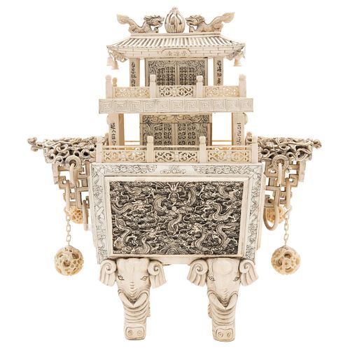 Temple, China, Early 20th century, Carved and inked ivory decorated with floral motifs, dragons and elephant-shaped legs.