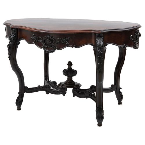Table, Early 20th century, Victorian style, Carved and ebonized wood decorated with plant motifs and a drawer.