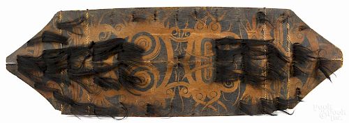 Dayak painted wood shield, Borneo, single board painted on both sides in traditional design