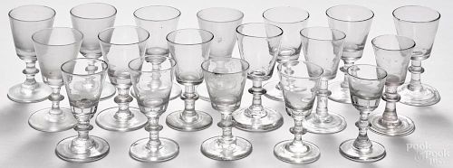 Thirty-five blown glass cordials, 18th/19th c., of similar form with wafer stems.