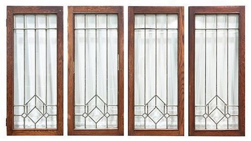 A Set of Four American Arts and Crafts Leaded Glass Windows Height 40 1/8 x width 17 1/2 inches.