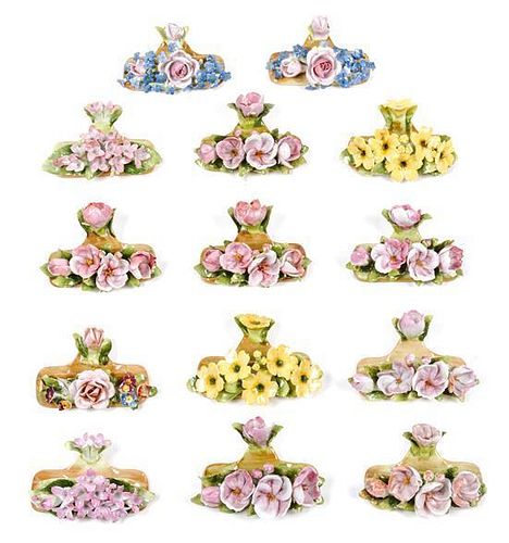 * A Set of Fourteen Porcelain Place Card Holders Length 2 1/2 inches.