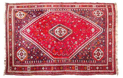 * A Northwest Persian Wool Rug 9 feet 10 inches x 7 feet 5 inches.