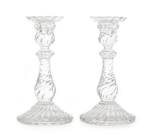 A Pair of Baccarat Candlesticks Height 9 inches.