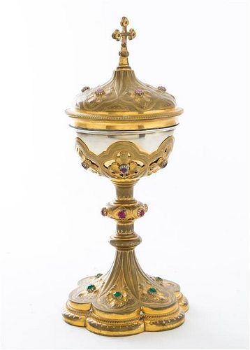 A French Silver and Brass Sacramental Cup and Cover, Maker's Mark LG, having a floriform foot and set with 24 paste jewels throu