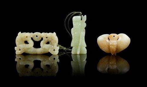 * A Group of Three Carved Jade Pendants Length of longest 2 5/8 inches.