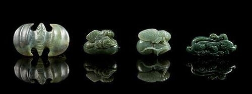 * A Group of Four Spinach Jade Pendants Length of longest 2 1/2 inches.