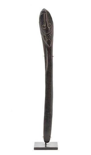 * An Oceanic Carved Palm Wood Spatula Length 12 3/8 inches.