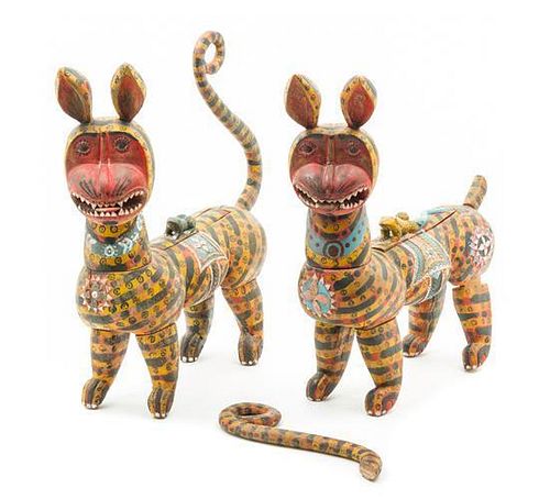 * A Pair of Polychromed Wood Hyenas Height of each 17 1/2 inches.
