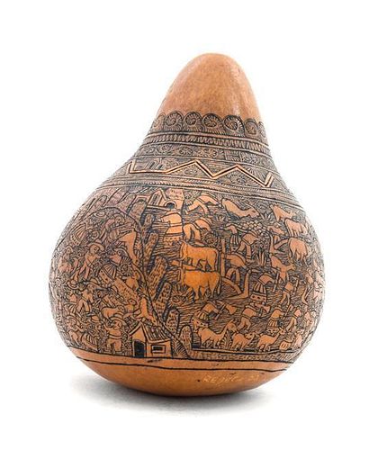 * A Peruvian Gourd Vessel Height 4 1/4 inches.
