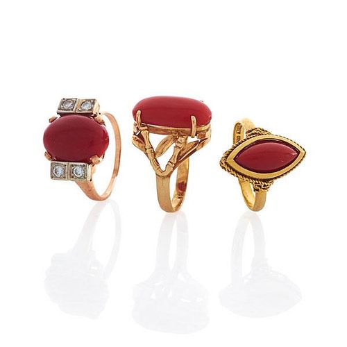 THREE YELLOW GOLD CORAL RINGS