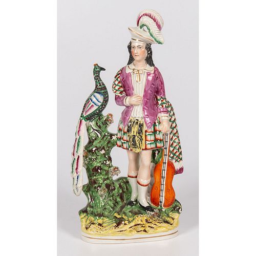 A Staffordshire Royal Figure with Peacock