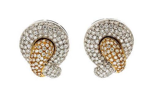 A Pair of 18 Karat Two Tone Gold and Diamond Pave Earclips, 19.10 dwts.