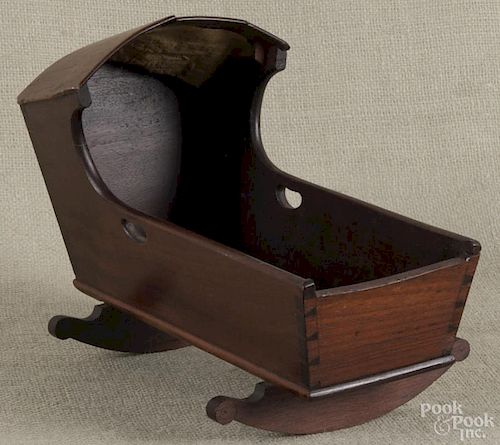Mahogany doll cradle, 19th c., 8 1/2'' h., 12'' l.
